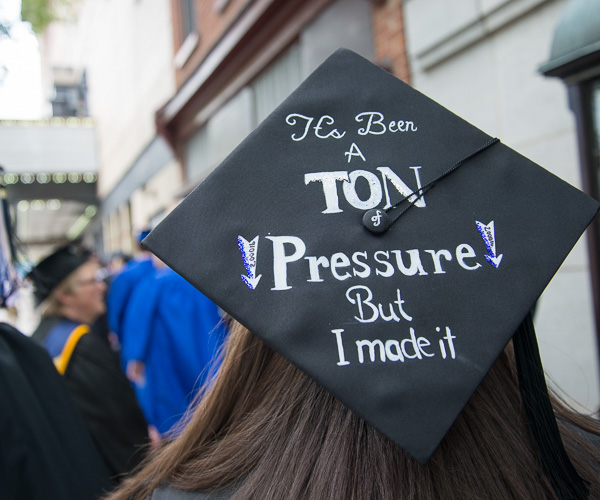 An engineering design graduate expresses the weight of the moment on her mortarboard. 
