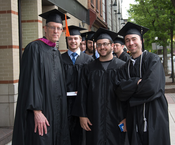 First in line for the Saturday morning commencement are Geoffrey M. Campbell (left), assistant professor of architectural technology, and students. 