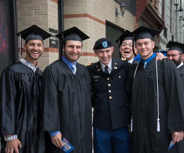 ROTC grad Kyle A. Csorba, earning a degree in residential construction technology management, enjoys the company of classmates.