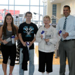 Winners of the Resolutions Fitness Challenge receive congratulations and prizes from Domenick S. Schiraldi-Irrera (left), fitness center assistant. From left are students Katelyn A. Wertz, a dental hygiene: health policy and administration concentration major from Bernville, and Bryan M. Behm, an aviation maintenance technology student from Fleetwood; Beverly A. Hunsberger, who recently retired as a college transition specialist; and Paul R. Watson, dean of academic services and college transitions.