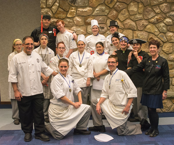Students in the Culinary Competition and Skills Assessment course gather with judges Chef Stephen J. Anania, ’90, instructor of culinary arts at the Career and Technology Center of Lackawanna County; and Chef Irene Maston, owner of Irene’s Cakes by Design in Okemo, Vermont.