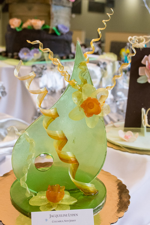 A sugar-art centerpiece by Jacqueline Lyden, of Kunkletown, highlights the buffet’s spring garden theme.