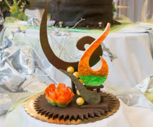A chocolate sculpture by Dylan H. Therrien, of Reading, helps to dress a table.