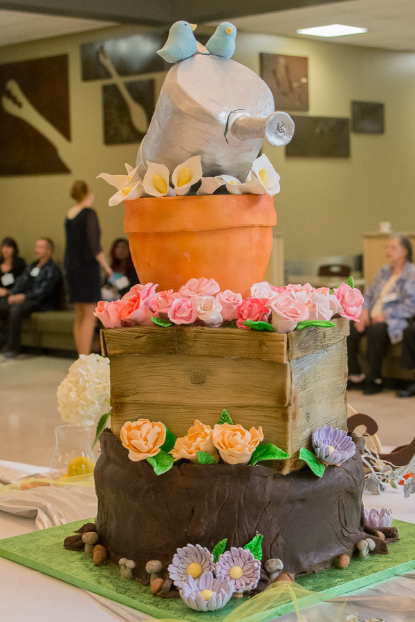 A sculpted cake, a group project by the class, anchors the buffet.