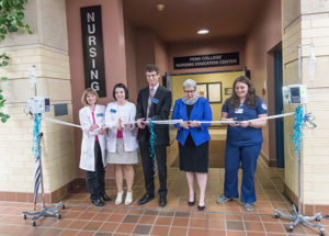 Cutting the “ribbon” to dedicate the Penn College Nursing Education Center are, from left, Dottie M. Mathers, associate professor of medical-surgical nursing; Sandra L. Richmond, director of nursing; Edward A. Henninger, dean of health sciences; President Davie Jane Gilmour; and student Monica A. Flexer, president of the Penn College Student Nurses' Association.
