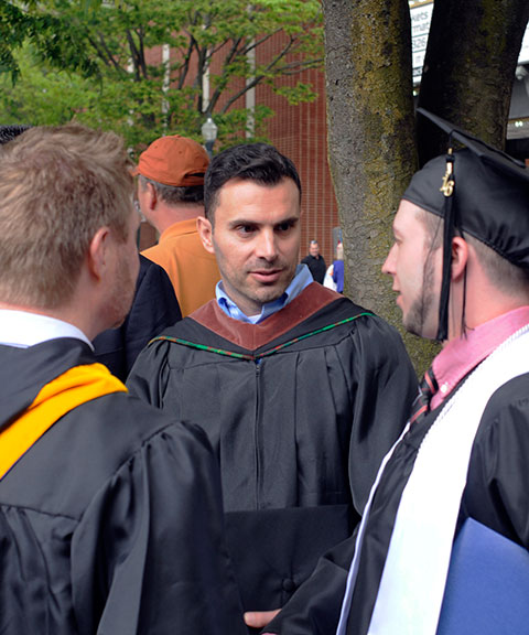 Timothy S. Shook (right), building science and sustainable design: architectural technology concentration, reunites with Daniel L. Brooks (left), instructor of architectural technology, and Naim N. Jabbour, assistant professor of architectural technology, after the Saturday morning ceremony.<br />
