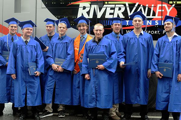 While generally surrounded by vintage vehicles, automotive restoration technology graduates have no problem fronting a natural gas-powered River Valley Transit bus.