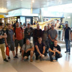 International student travelers await their flight from JFK to Zurich.