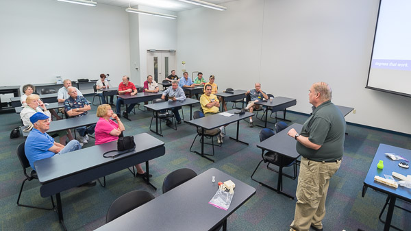 Eric K. Albert, associate professor of machine tool technology/automated manufacturing, leads a seminar in 3-D printing ...