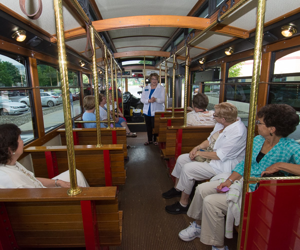 ... and leads a “Ladies’ Campus Tour” aboard a historic trolley operated by River Valley Transit. 