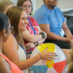 The Connections beach ball, a toss-able conversation piece that probingly elicits answers to the day's important questions – Favorite jelly bean flavor? iPhone or Android? High school nickname? – lands with Amber M. Gardner. The Sugar Grove resident will be a pre-dental hygiene student this fall.
