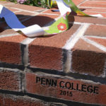 A ribbon rests atop a pillar constructed by Penn College masonry students. (Photo by Carol A. Lugg, assistant dean of construction and design technologies)