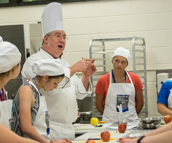 Chef Frank M. Suchwala, associate professor of hospitality management/culinary arts, takes campers under his toque.