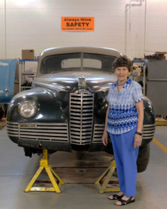 Eleanor Packard stands by the 1947 Packard Custom Super Clipper that has been donated to Penn College’s automotive restoration technology major.