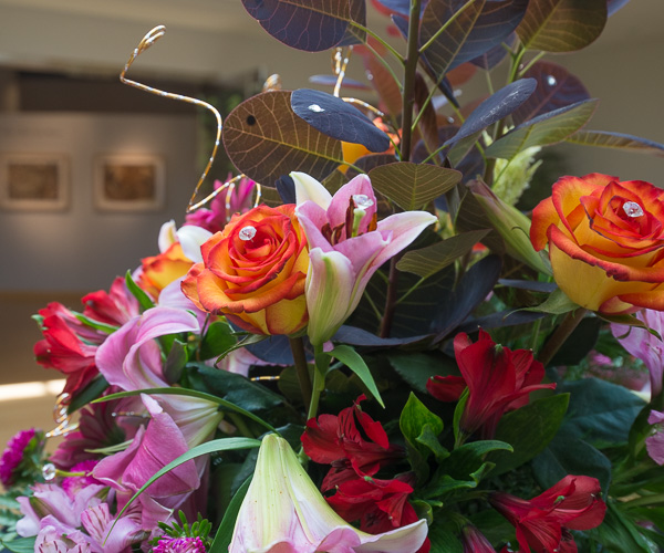 A floral arrangement in the gallery lobby appropriately holds 
