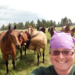 “There were horses everywhere out there, and they could do pretty much whatever they wanted,” Thomas says. On this day, she was elated to get close enough to join them in a photo.