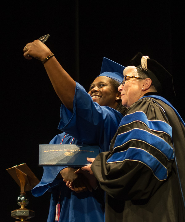 This is definitely a selfie-worthy moment for Kyeesha Douglas, who earned an associate degree in legal assistant/paralegal. 