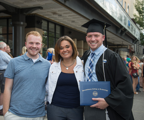 Physician assistant grad Cavan R. irvine celebrates with college friends Trevor I. Brandt, now an admissions representative, and Katelyn A. Wertz. 
