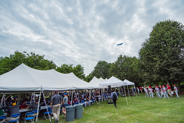 The DIRECTV blimp flies over campus during the picnic.