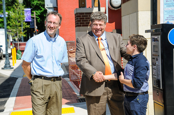Mulroy (right) is congratulated by Rob A. Wozniak (left), associate professor of architectural technology, and Marc E. Bridgens, dean of construction and design technologies ...