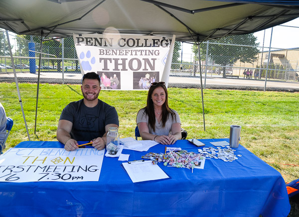 Representing the college's THON chapter, which raises money to fight pediatric cancer, are engineering design technology majors Ian E. Gardepe and Rylee A. Butler.