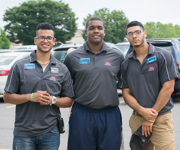 Residence Life coordinator Xavier J. Warner is flanked by RAs Wilmer I. Clase (left) and Andre J. Aldubayan.