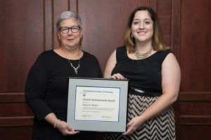 Penn College President Davie Jane Gilmour (left) presents the Alumni Achievement Award to Megan E. Wright, of Hummelstown.