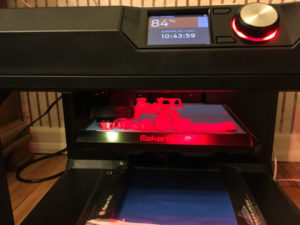 A 3-D printer produces a child-designed toy.