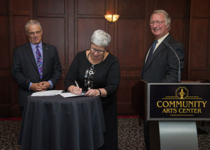 Trachte (left) and Martin, Gilmour signs an agreement allowing Lycoming College increased access to the Community Arts Center for performing arts, academic and community outreach events.