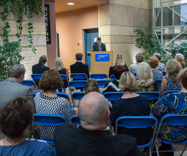 Edward A. Henninger, dean of health sciences, serves as master of ceremonies for the welcoming remarks that preceded tours of the clinic.