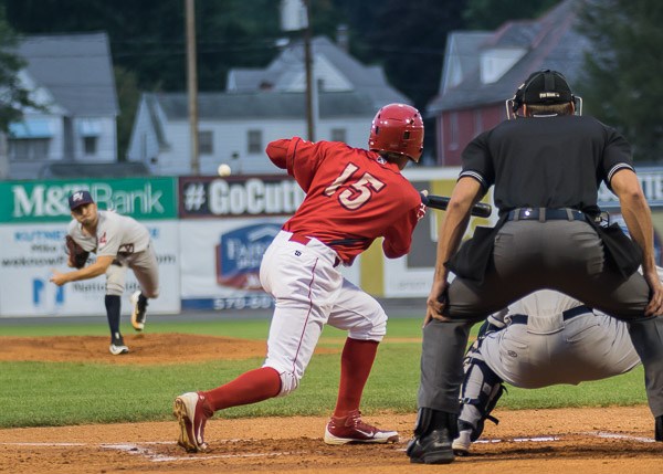 Enmanuel Garcia, whose late-game RBI double would give the 'cutters the winning edge, readies a bunt attempt.