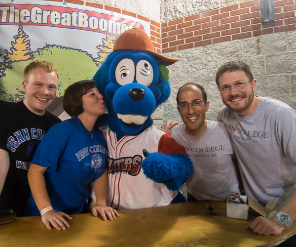 Admissions representatives cozy up to Boomer, the Crosscutters' mascot. From left are Trevor I. Brandt, Sarah R. Shott, Mark R. Capellazzi and Sean M. Stout.