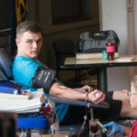 Kevin J. Peterman, a business management major from Muncy, gives blood Wednesday through a special machine that allows safe donation of two units of red cells during one visit while returning plasma and platelets to the donor.