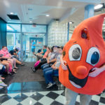 Buddy the Blood Drop, the mascot of Red Cross Blood Services, helps welcomes donors to Penn's Inn on Wednesday.