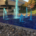The waters of the Veterans' Fountain adopt a Wildcat Blue tint for Homecoming & Family Weekend. 