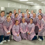 Dental hygiene students, colorfully cloaked as special agents for awareness