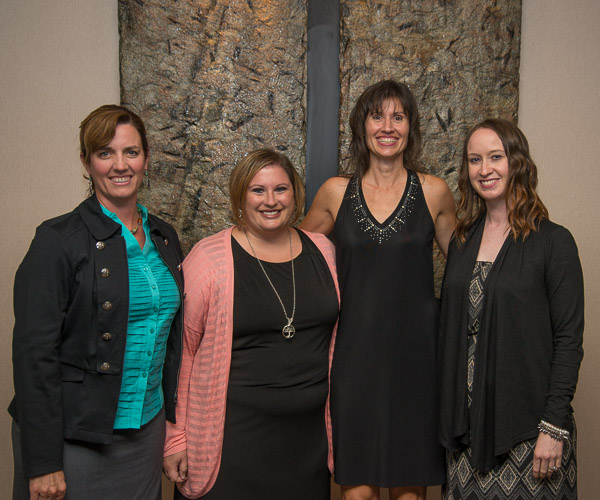 Among those joining Hawkins (second from right) on her special night are former women’s volleyball coaches/assistant coaches (from left): Michelle W. Bower, Amber L. (Geckle) Dreese and Erin (McMahon) Skonecki. Dreese, ’07 applied human services and one of Hawkins’ former players, introduced Hawkins to the banquet crowd. 