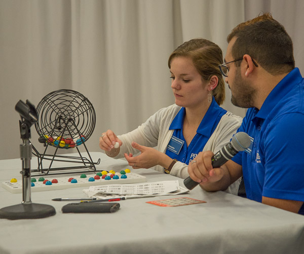 Student Activities event assistants Alexandra M. Lehman and Duncan Rodriguez call out bingo numbers.