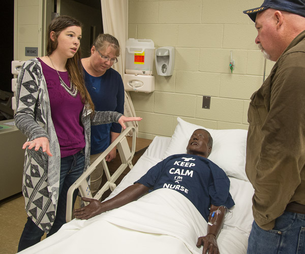 Nursing student Kimberly A. Ward, of Morrisdale, shows her parents a high-tech mannequin in the nursing labs. 