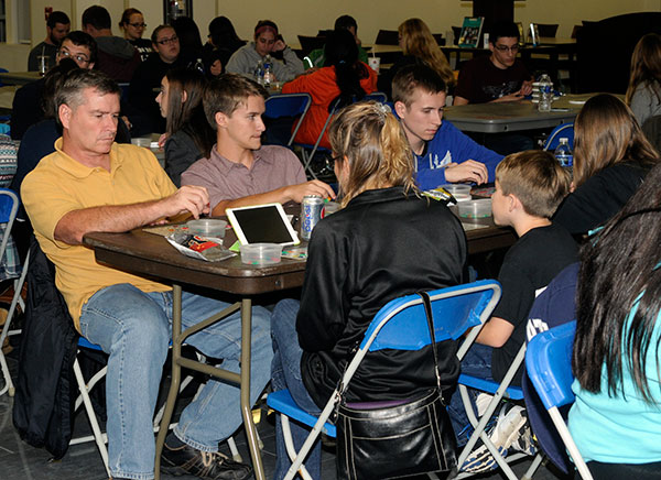 Filling a table unto itself is the Caler family, back for its second year of bingo fun. Son Noah T. (in blue) is a business management major.