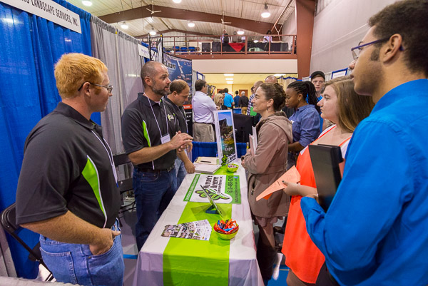 Nature's Accents Landscape Services Inc., Hamburg, stacks the deck with Penn College alumni. From left are Cody A. Reilly, 2013; Travis M. Breininger, 2001; Anthony S. Moyer, 2007; and (behind the crowd) Justin H. Bentz, 2001 ...