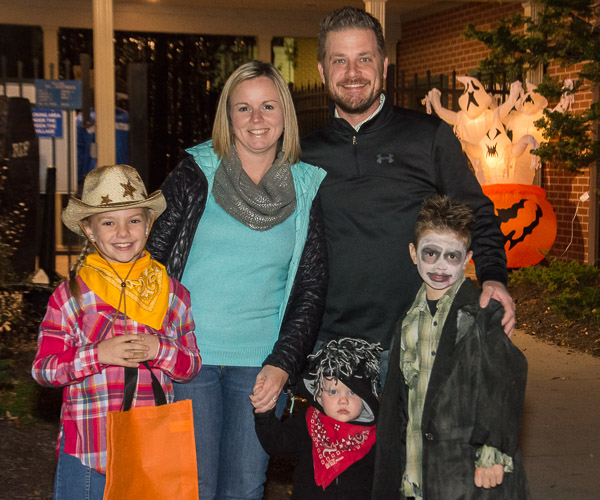 What's a family event without the family! Jason K. Eisensehr, dining services manager, gathers his crew for trick-or-treating at The Village.