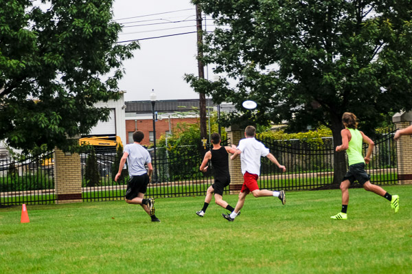 Returning grads take on current students in an Ultimate Frisbee match ...