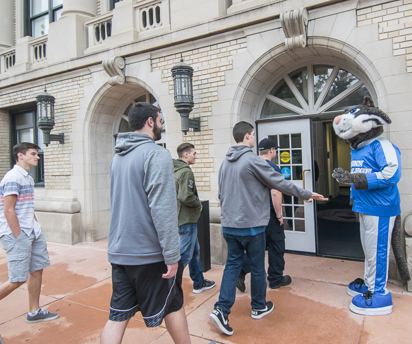 High school students are welcomed to Klump Academic Center by the coolest cat on campus.