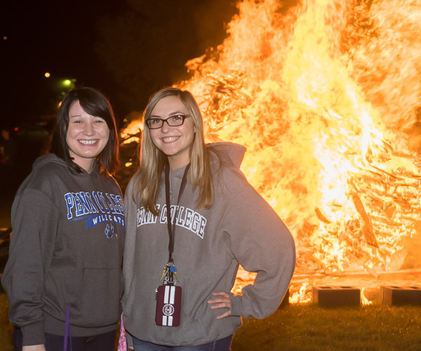 Hoodie-clad hospitality management students Taylor M. Barrett (left) and Crystal L. Harker ward off the evening chill.