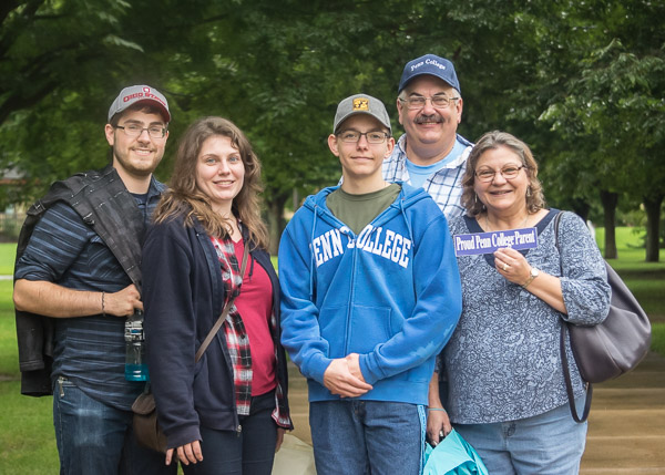 Michael J. Policare (center), a heating, ventilation and air conditioning technology major from Allentown, shares the weekend with a friend, sister and parents.