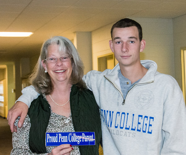 First-year building construction technology student John J. Geise IV, of Mystic, Conn., shows Mom Jennifer around the construction and design facilities.