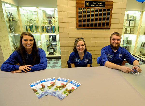 Student Ambassadors (from left) Lindsey A. King, Morgan N. Keyser and Alexander R. Wetzel await tour groups leaving from the Campus Center.