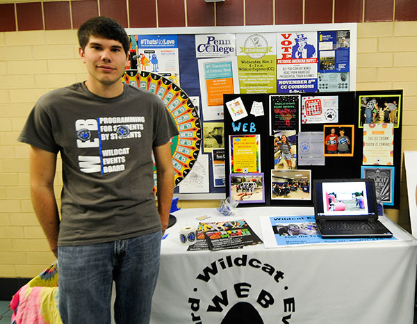 Student Robert L. Sloss, of Stroudsburg, staffs a Wildcat Events Board table at the Campus Life Involvement Fair.