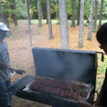 Faculty members Golshan (left) and Yoas staff the grill with perfection ...